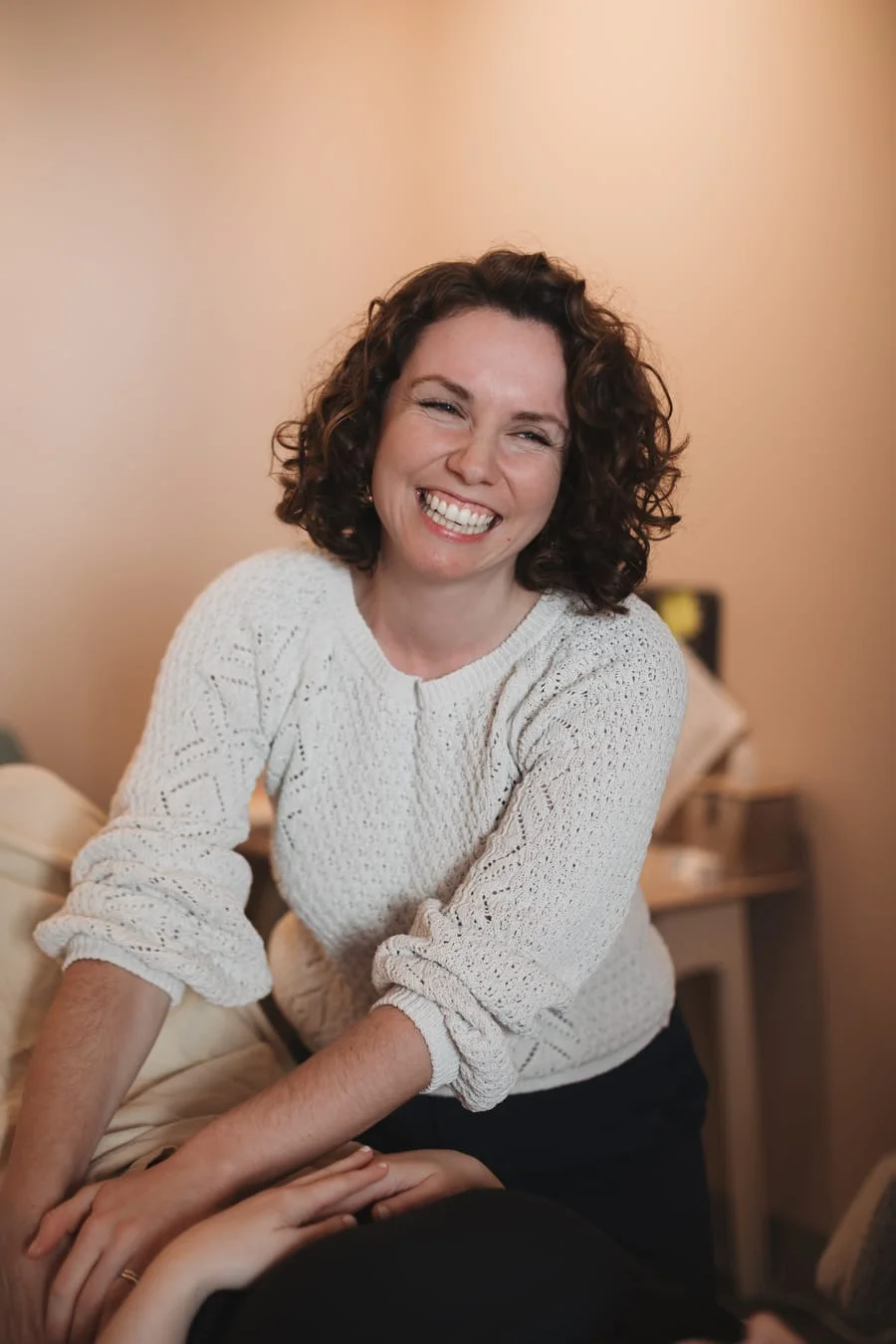 A Foundations physical therapist smiling during a treatment session