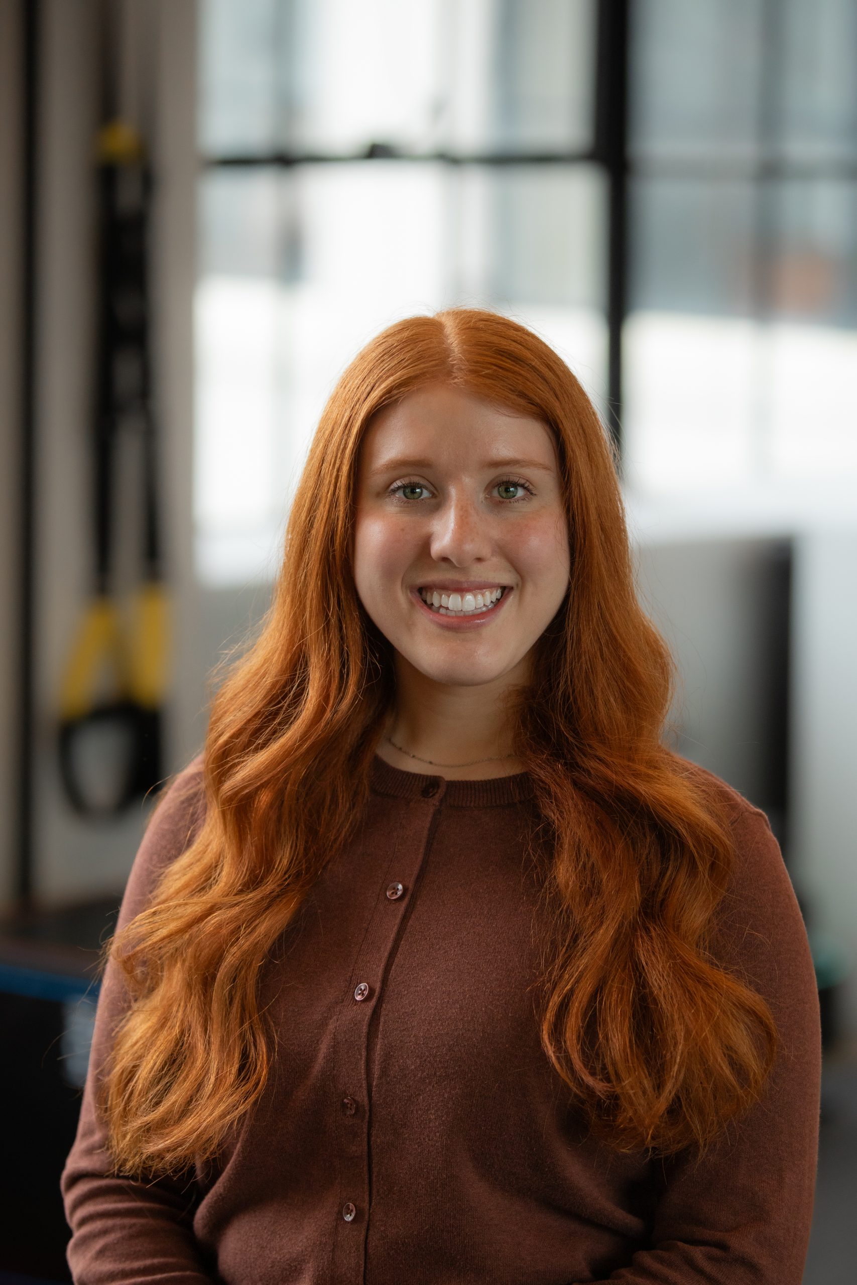 Portrait photo of Hadassah (Dassi) Ginsberg, PT, DPT in a physical therapy center with a blurred background